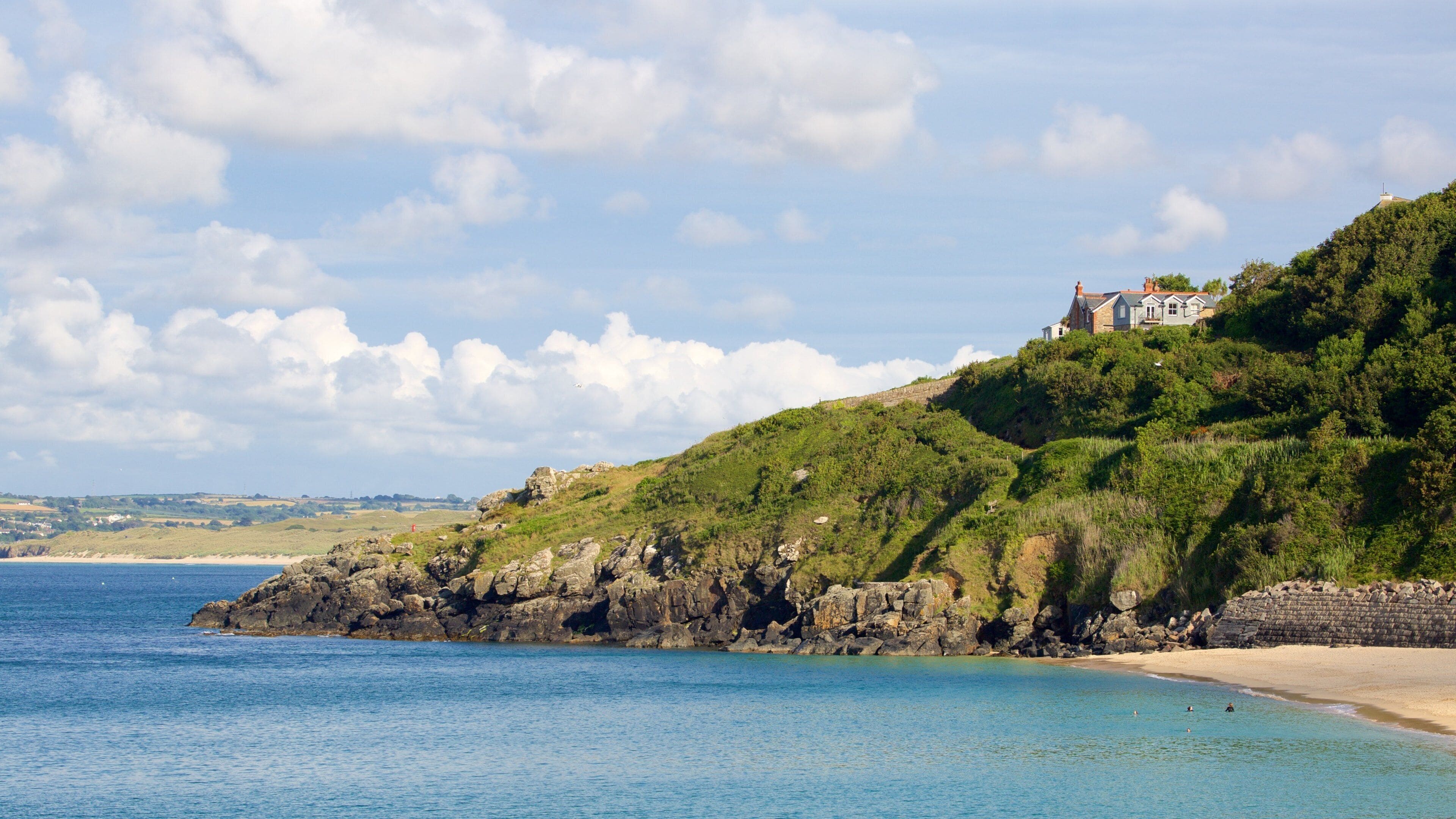 Porthminster Beach showing a coastal town and a sandy beach