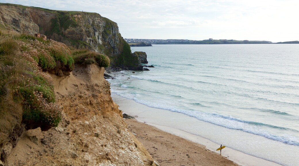 Watergate Bay showing a sandy beach and rocky coastline