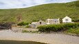 Crackington Haven featuring a pebble beach and a house