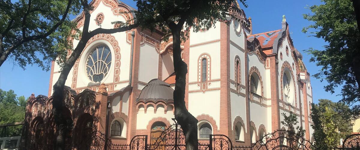 A historic church with ornate architecture and a large central dome.