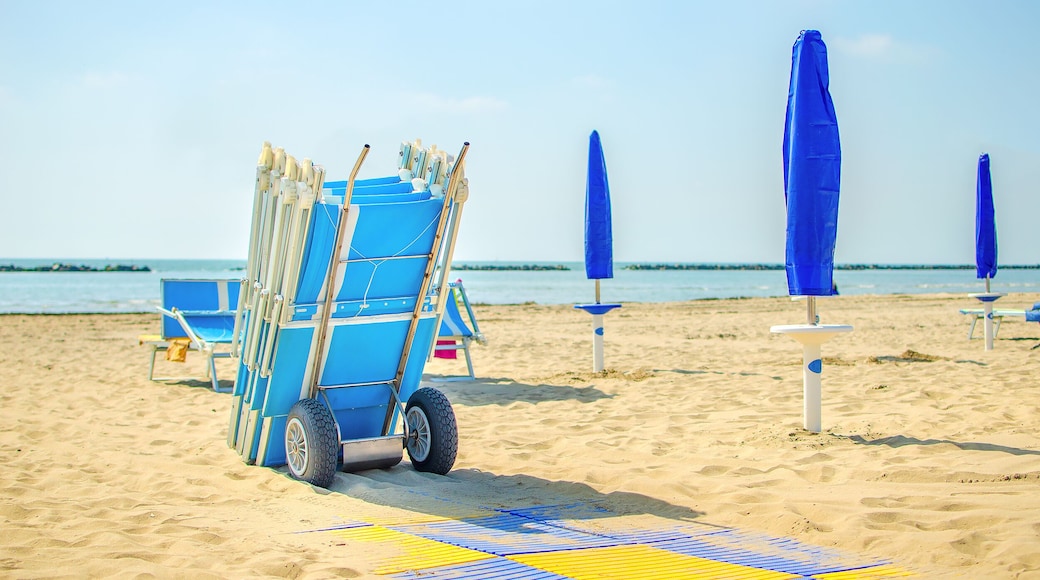 end of summer beach deckchair closed umbrella