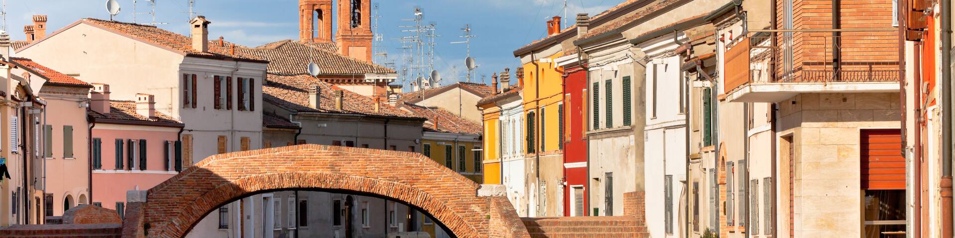 Comacchio (Ferrara, Emilia Romagna, Italy). Canal with bridge and colorful houses., Shutterstock ID 118107556, SF SSA Case with Manager Approval: Case 07151371, Job: Prepay credit, Client/Licensee: ,