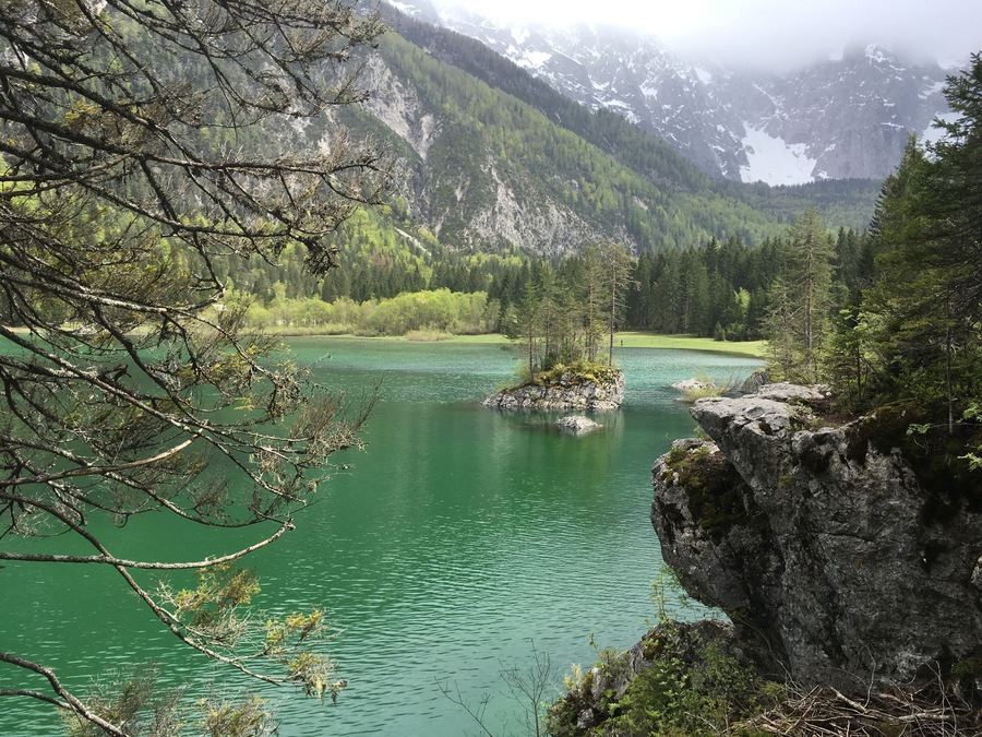 Take the road beyond Fusine (closed in wintertime) towards the Laghi and this emerald mountain lake with grant views is your reward. There are several spots where you see the water bubbling upwards, vulcano style, which fits perfectly with the idyllic scenery. 
The hike around this upper lake takes a good one and a half hour, depending on how many benches you want to try out. There is a connecting trail to the lower lake as well - will try that next time!