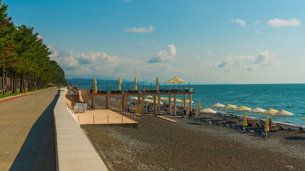 KOBULETI, GEORGIA: Landscape with a view of the promenade by the beach on the Black Sea on a sunny summer day.