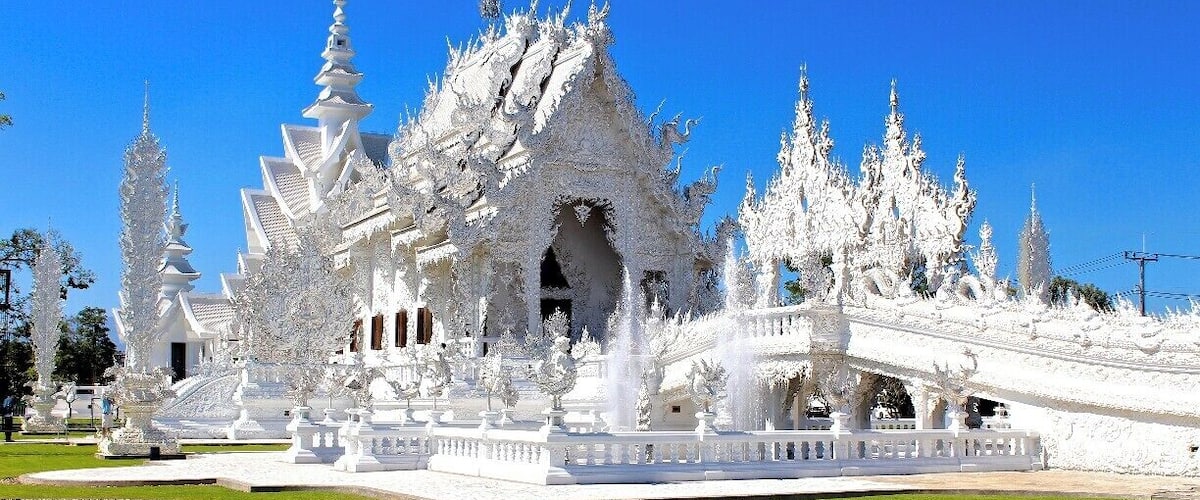 Also known as the White Temple, Wat Rong Khun is one of our favorite temples in Thailand. The beautiful architecture and intricate details will leave you in awe.
For more info on our visit to Chiang Rai, please visit http://thetradingtravelers.com/chiang-rai-in-twenty-four-hours/