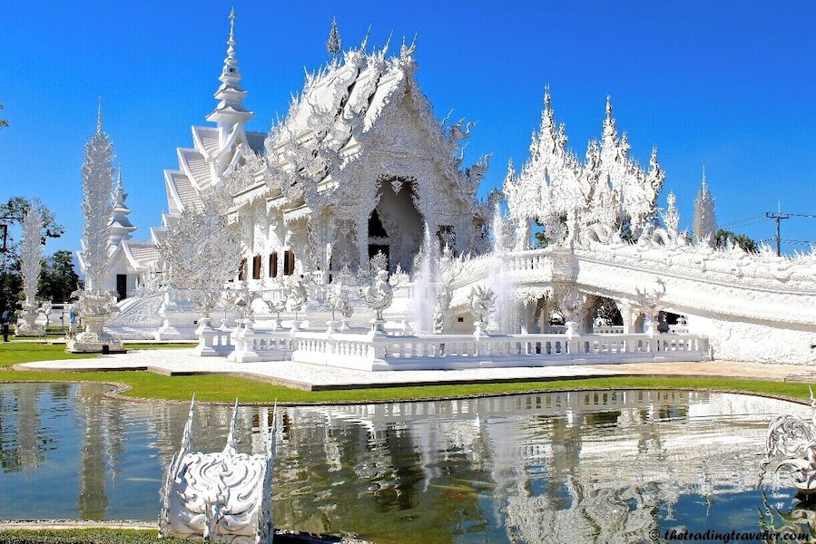 Also known as the White Temple, Wat Rong Khun is one of our favorite temples in Thailand. The beautiful architecture and intricate details will leave you in awe.
For more info on our visit to Chiang Rai, please visit http://thetradingtravelers.com/chiang-rai-in-twenty-four-hours/