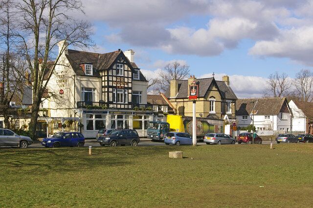 The Crown Inn and White Lodge. The Crown Inn originally dates from 1874 (see 1706092). White Lodge (the pale brick building to its right, so a slight misnomer) also dates from around 1875.