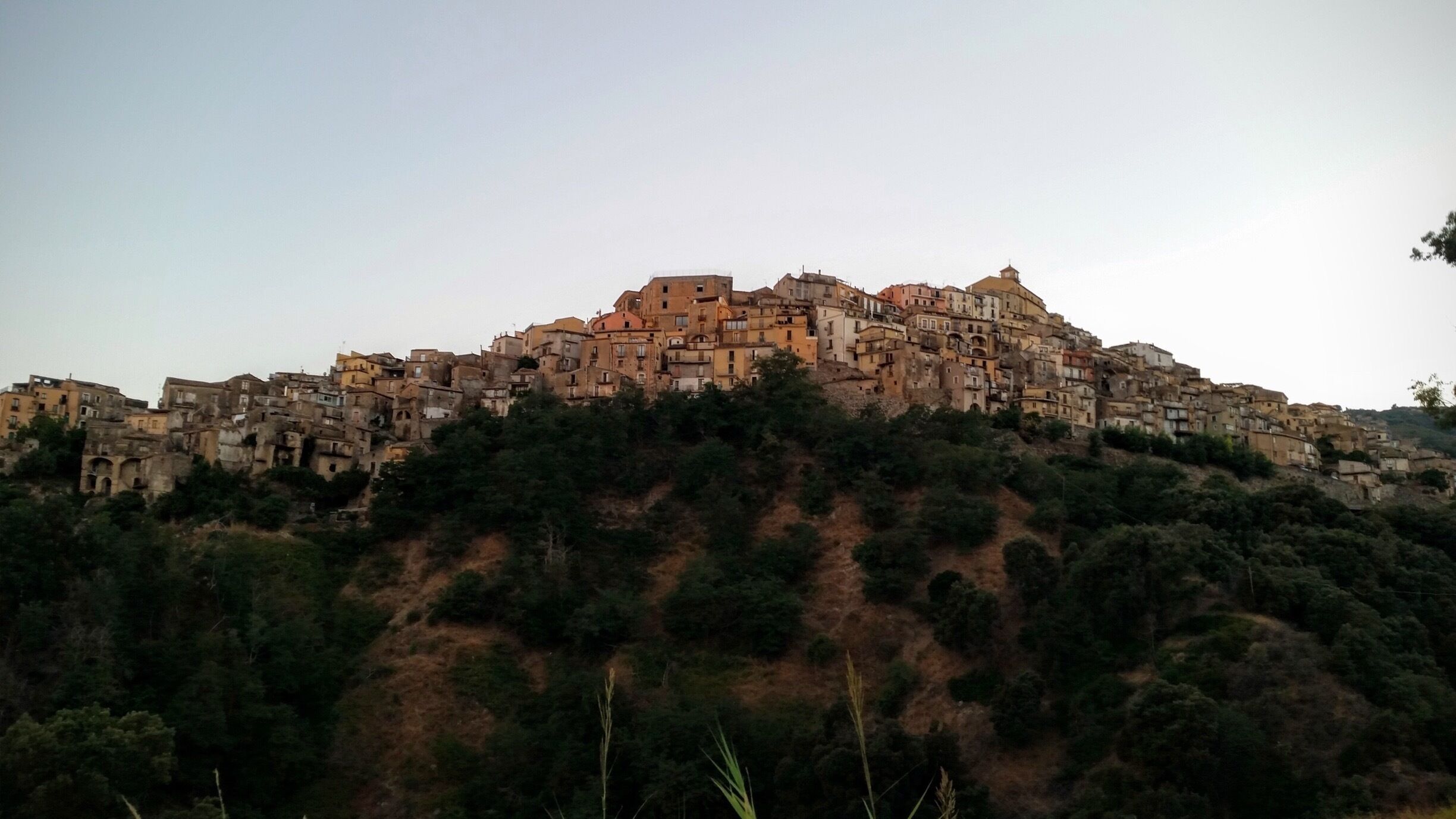 A densely packed hillside town with historic architecture.