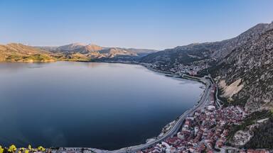 Aerial scenic view of Egirdir lake peninsula and town in Isparta region. Calm turquoise and scenic coast of national park in Turkey
