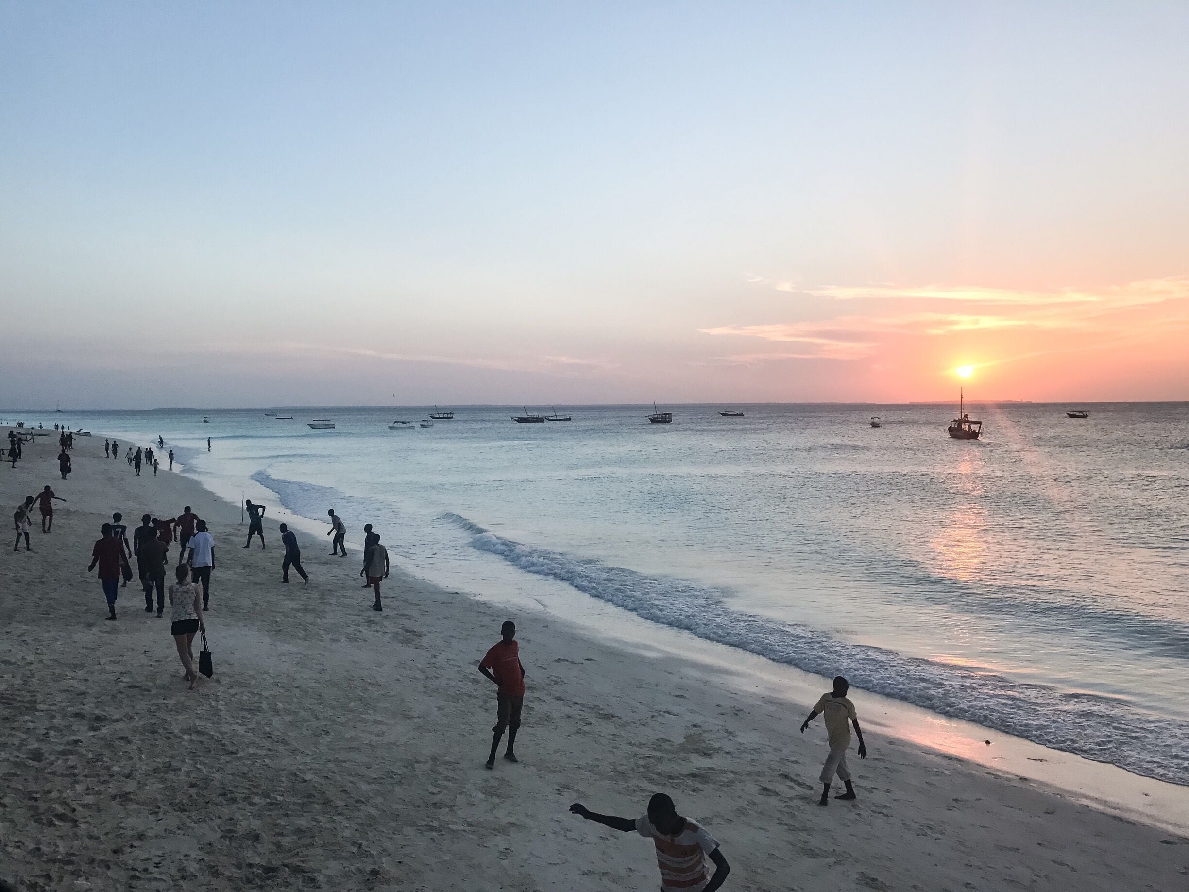 The beach comes alive with local boys playing soccer at sunset. #islandlife @lens4change