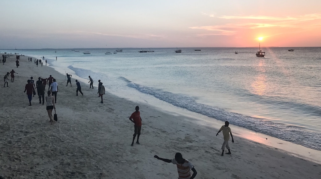 The beach comes alive with local boys playing soccer at sunset. #islandlife @lens4change
