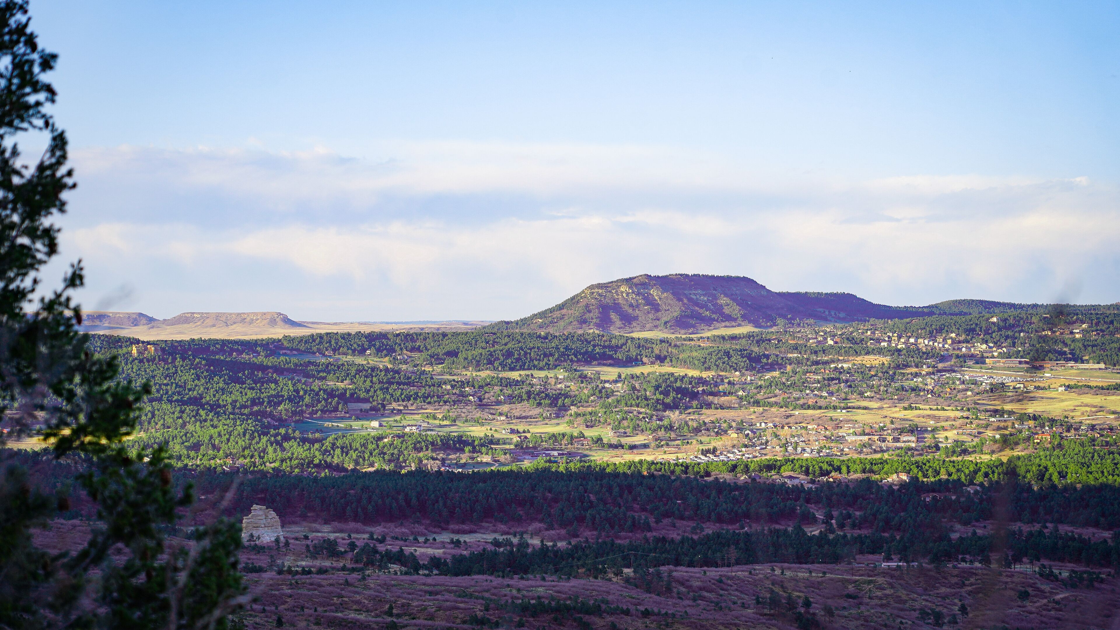 A mountainous landscape with a town in the valley.