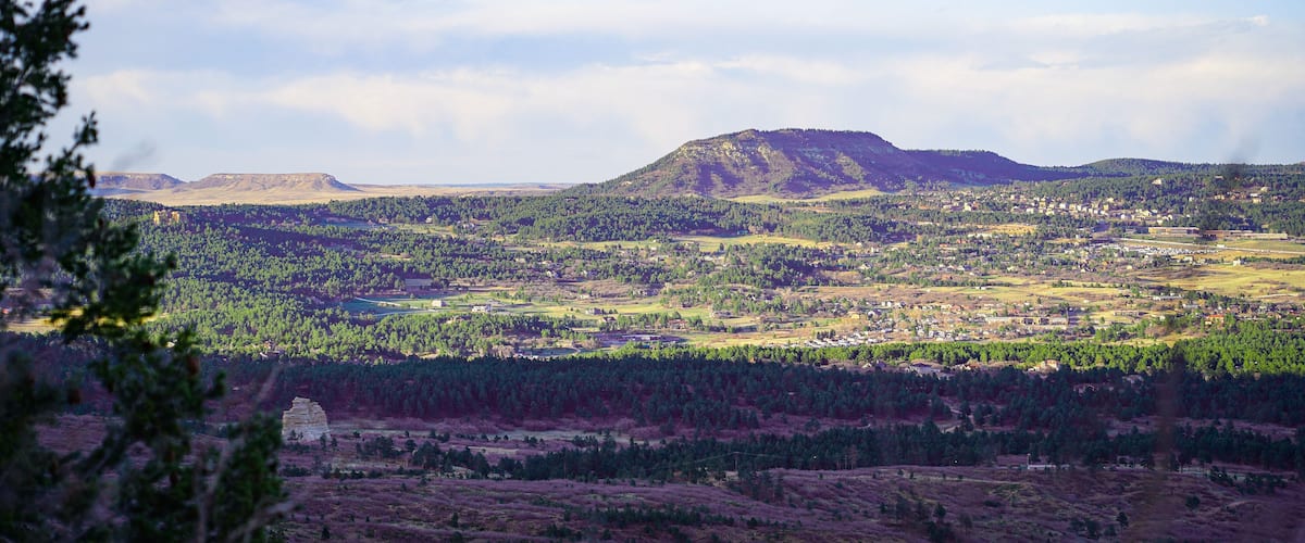 A mountainous landscape with a town in the valley.