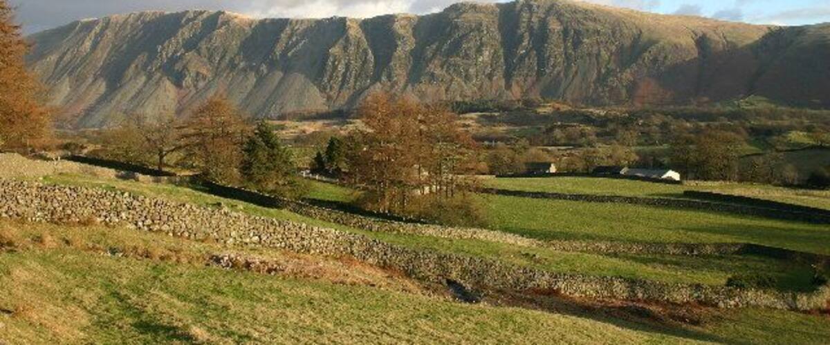 Farmland and Fells. Wastwater Screes are the backdrop; the vast majority of pictures of The Screes include the lake itself. The land is mainly used for sheep rearing.