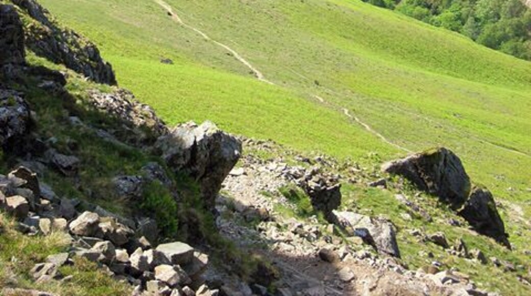 Path descending from Yewbarrow to Wast Water The view from Dropping Crag. The path can be seen traversing the hillside to rejoin the ridge. Over Beck is in the valley to the right. Bowderdale Farm is to the extreme right