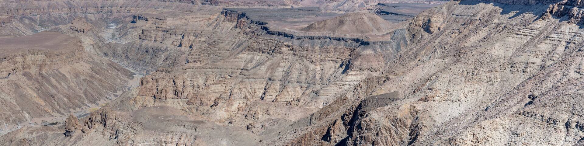 escarpment worn slopes and meandering dry riverbed looking north from Canyon viewpoint, Fish River Canyon, Namibia