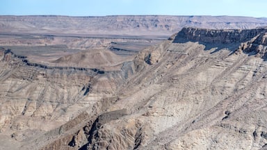 escarpment worn slopes and meandering dry riverbed looking north from Canyon viewpoint, Fish River Canyon, Namibia