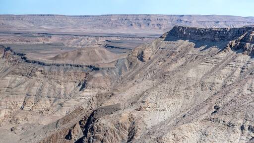 escarpment worn slopes and meandering dry riverbed looking north from Canyon viewpoint, Fish River Canyon, Namibia