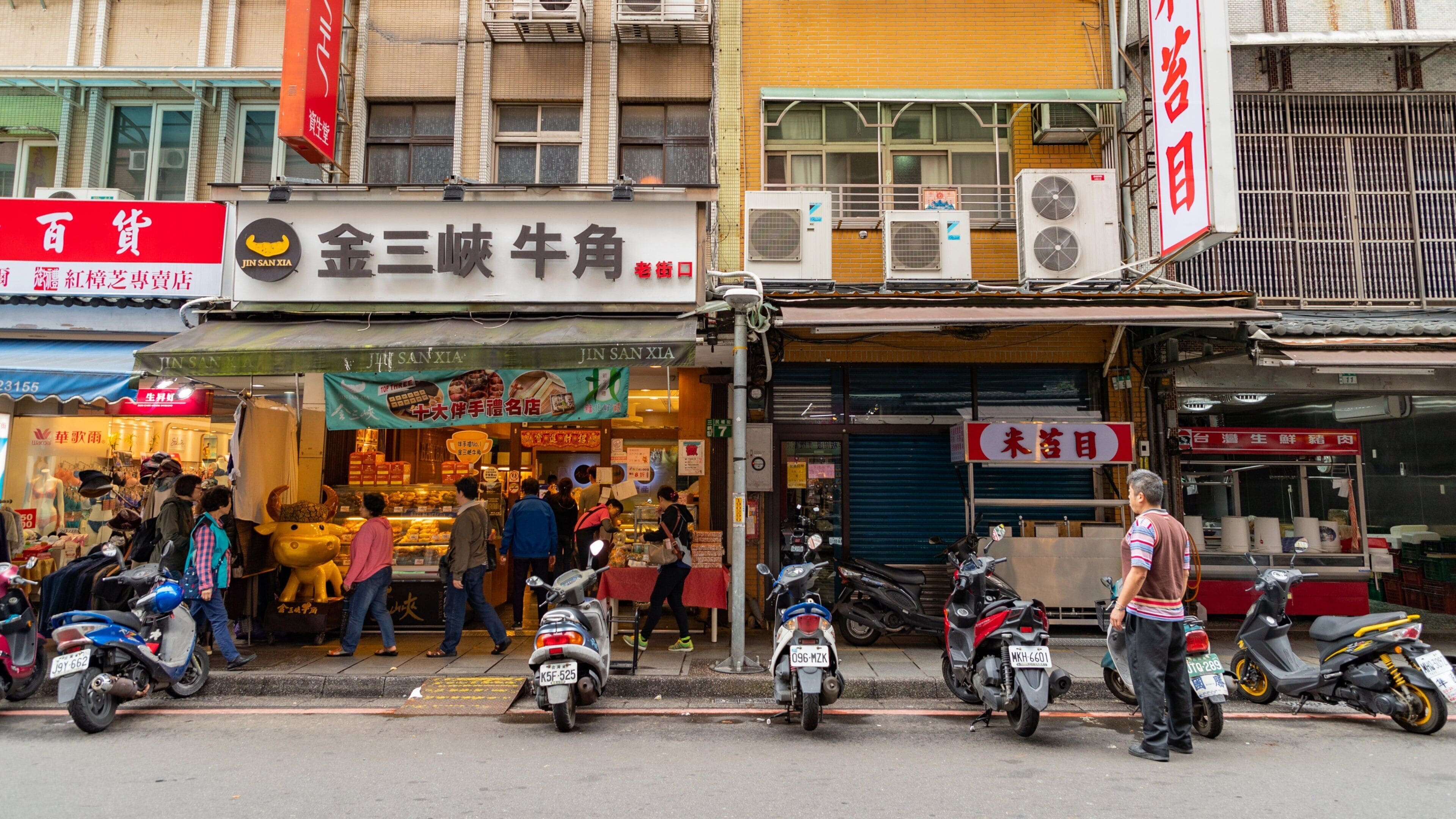 Sanxia featuring street scenes as well as an individual male