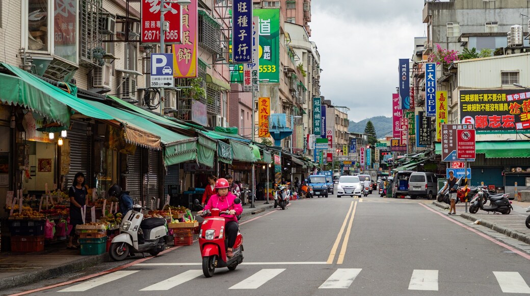 Sanxia which includes motorbike riding and street scenes