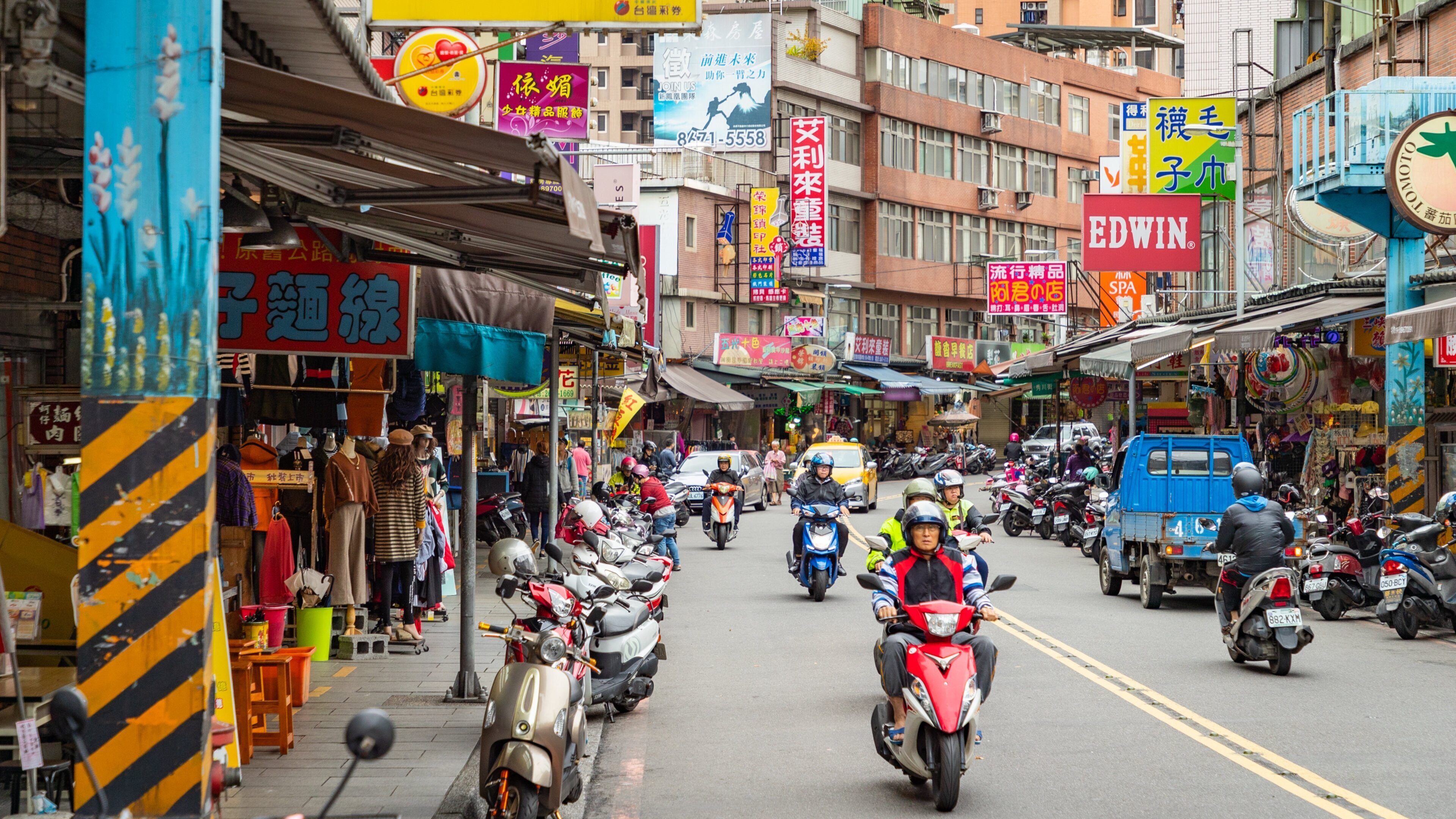 Sanxia featuring motorcycle riding and street scenes