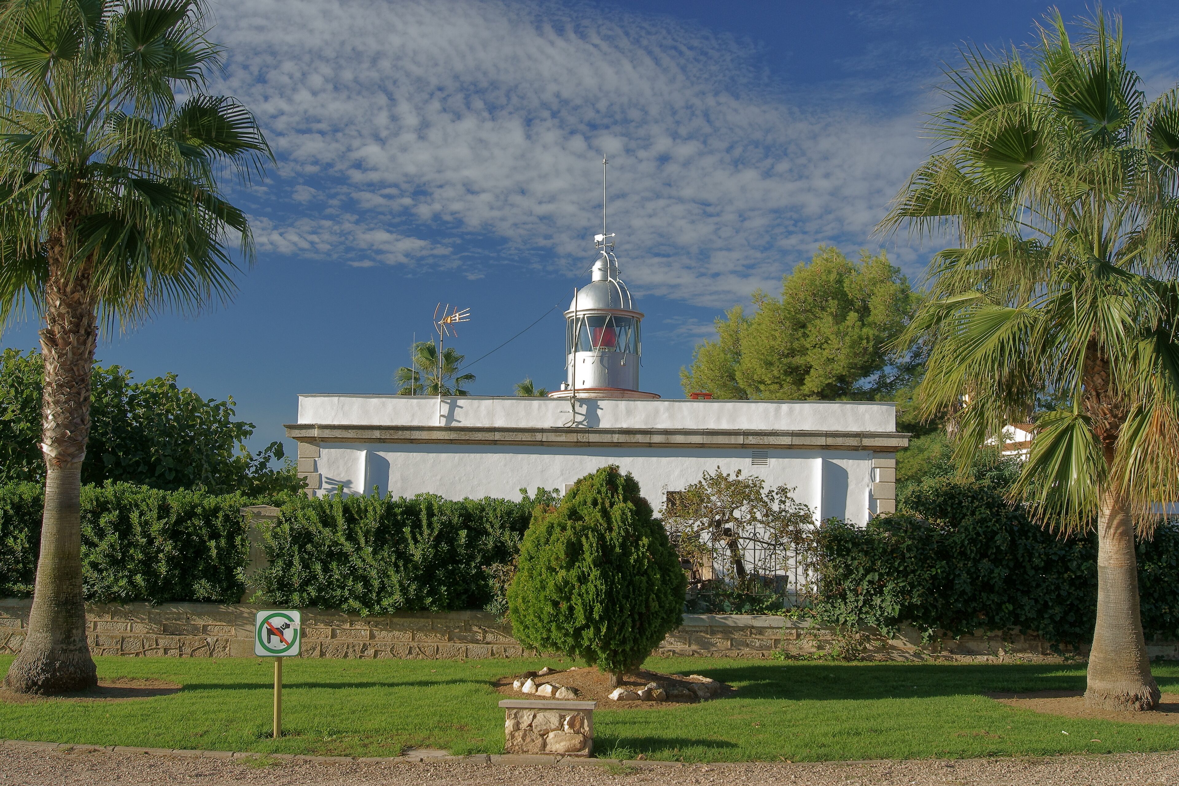 Red light lighthouse, located in one of the extremes of the Los Alfaques bay, in Ebro Delta. San Carlos de la Rápita, Tarragona, Spain