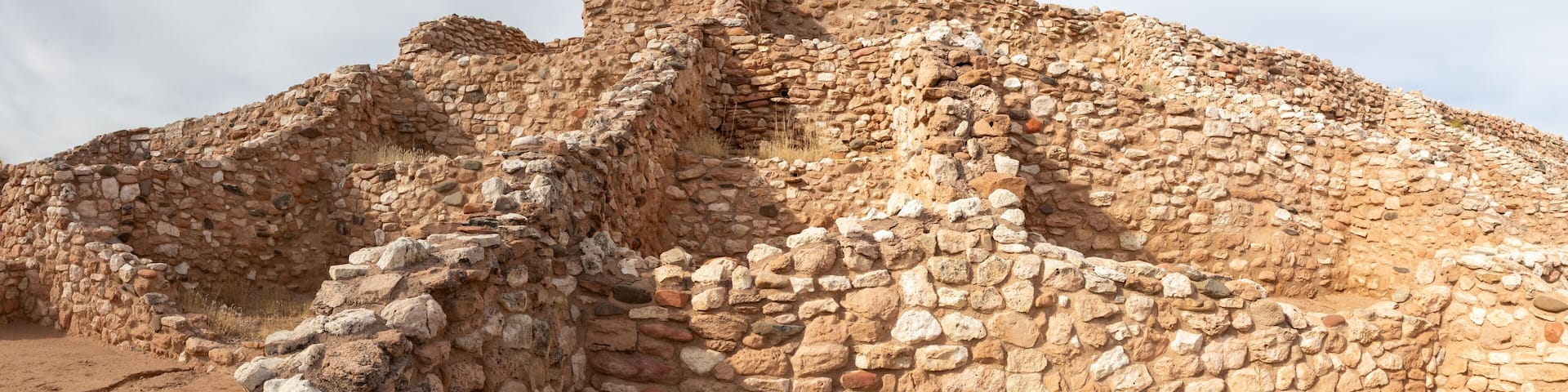 Ancient stone ruins with a prominent tower.