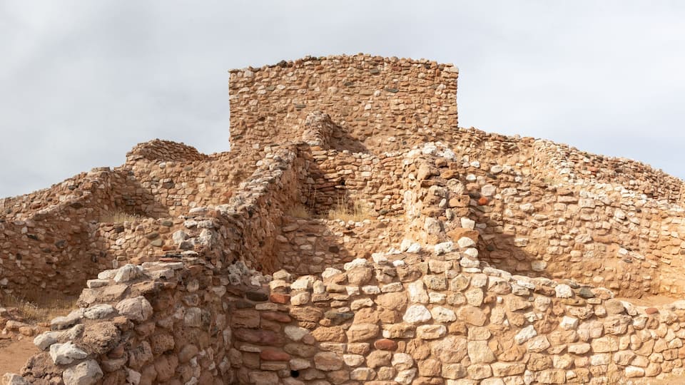 Ancient stone ruins with a prominent tower.