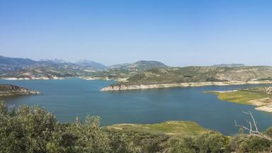 Iznajar lake surrounded by olive groves and pine woods, Cordoba province, Andalusia, Spain