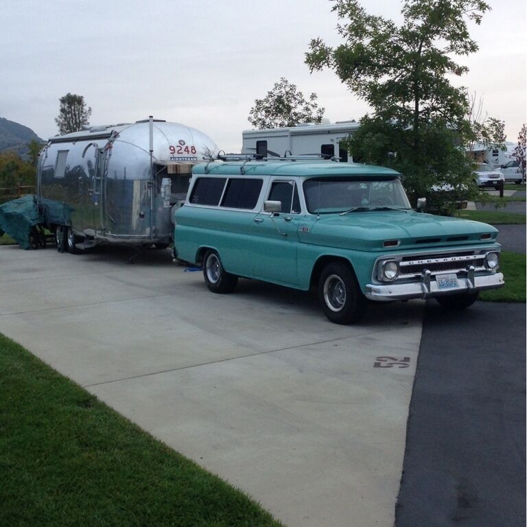 Another polished Airstream with its classic Suburban. 