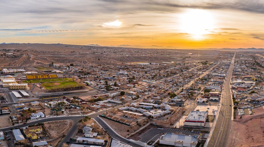Aerial view of Barstow community a residential city of homes and commercial property community Mojave desert California USA at sunset