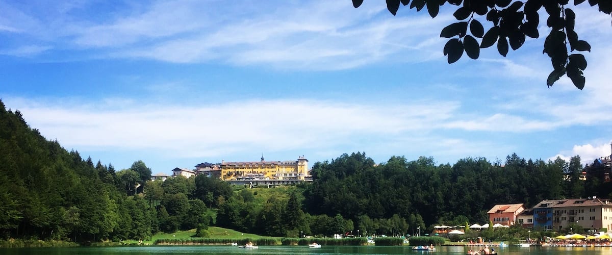 A small lake in Trentino mountains where you can relax in many ways: on the beach, on a boat, swimming, walking around it. #trentino #italy #alps #lavaronelake