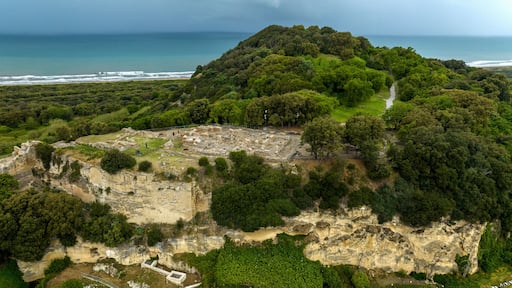 Aerial view of the archaeological excavations of Cuma, in the province of Naples, Campania, Italy. On the hill are the remains of the ancient city of Cumae, one of the oldest Greek colonies in Italy.