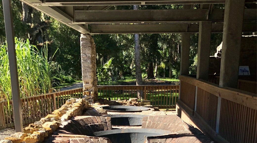 Burned to the ground in 1835 during the Seminole Wars the ruins of the sugar mill include these cooking kettles. Liquid was extracted from the sugar cane by a large press. The liquid was than placed in these kettles and the liquid was boiled off leaving raw sugar crystals. It was a very labor intensive process requiring 25 enslaved people here at Dunlawton.