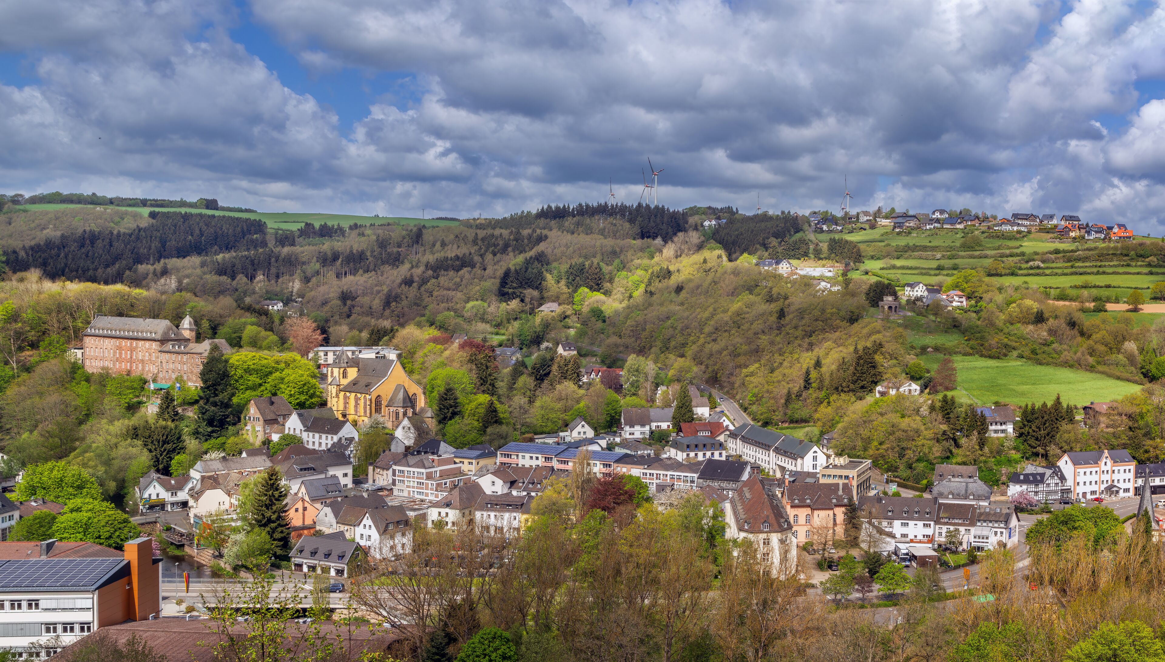 Panoramic aerial view of Schleiden town from a hill in Eifel Germany. High angle cityscape of historic architecture