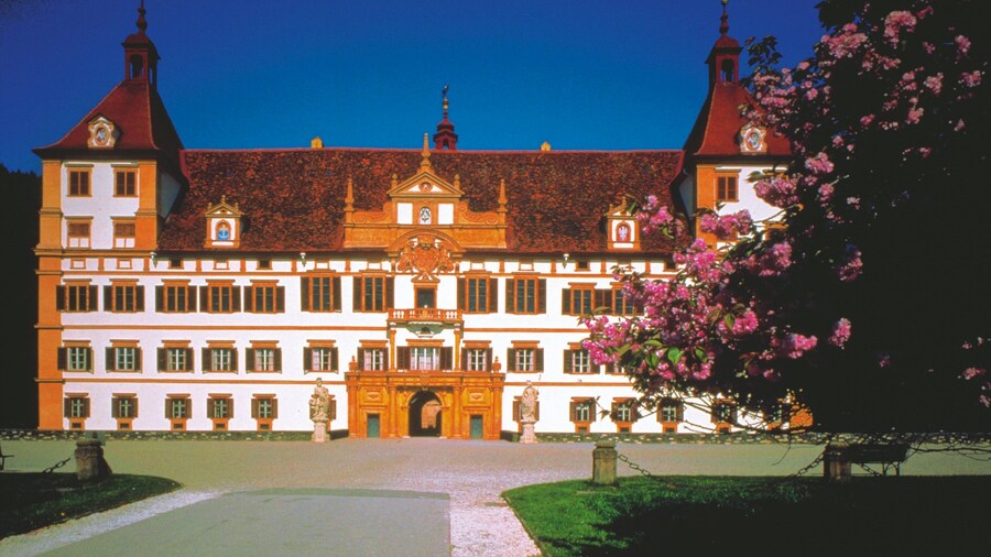 Eggenberg Palace featuring a castle, a city and heritage architecture