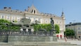 New Square showing a fountain, heritage elements and a statue or sculpture