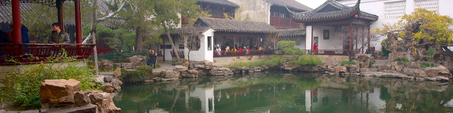 Master of the Nets Garden featuring religious aspects, a pond and a temple or place of worship