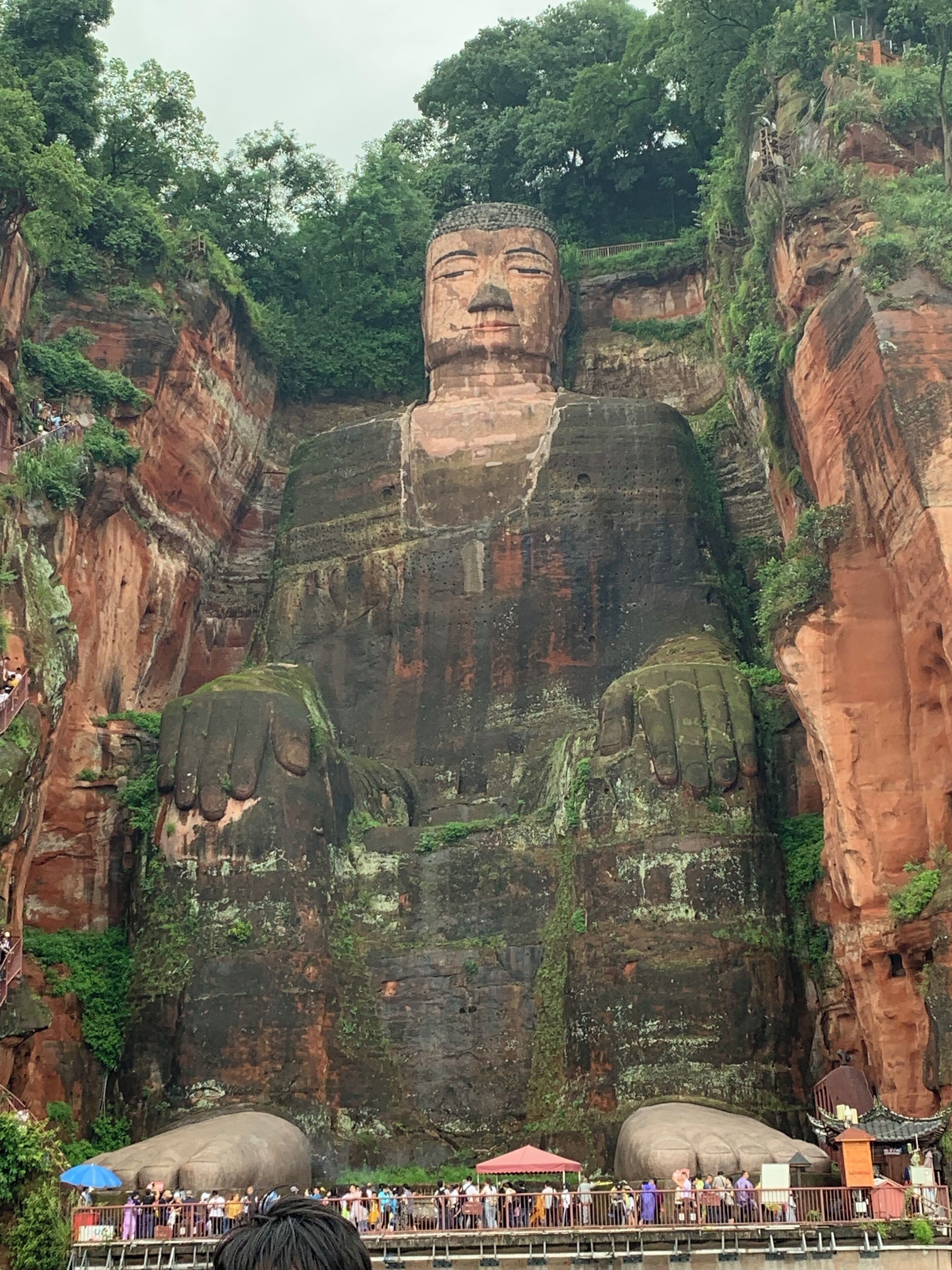 Breath taking views from the mountain or river, the giant Buddha sits peaceful as the people go by #Nature