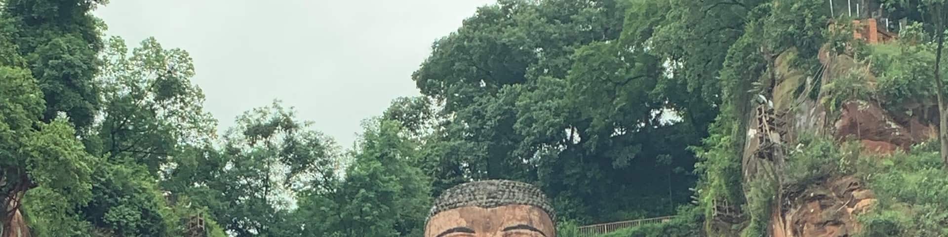 Breath taking views from the mountain or river, the giant Buddha sits peaceful as the people go by #Nature