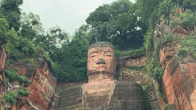 Breath taking views from the mountain or river, the giant Buddha sits peaceful as the people go by #Nature