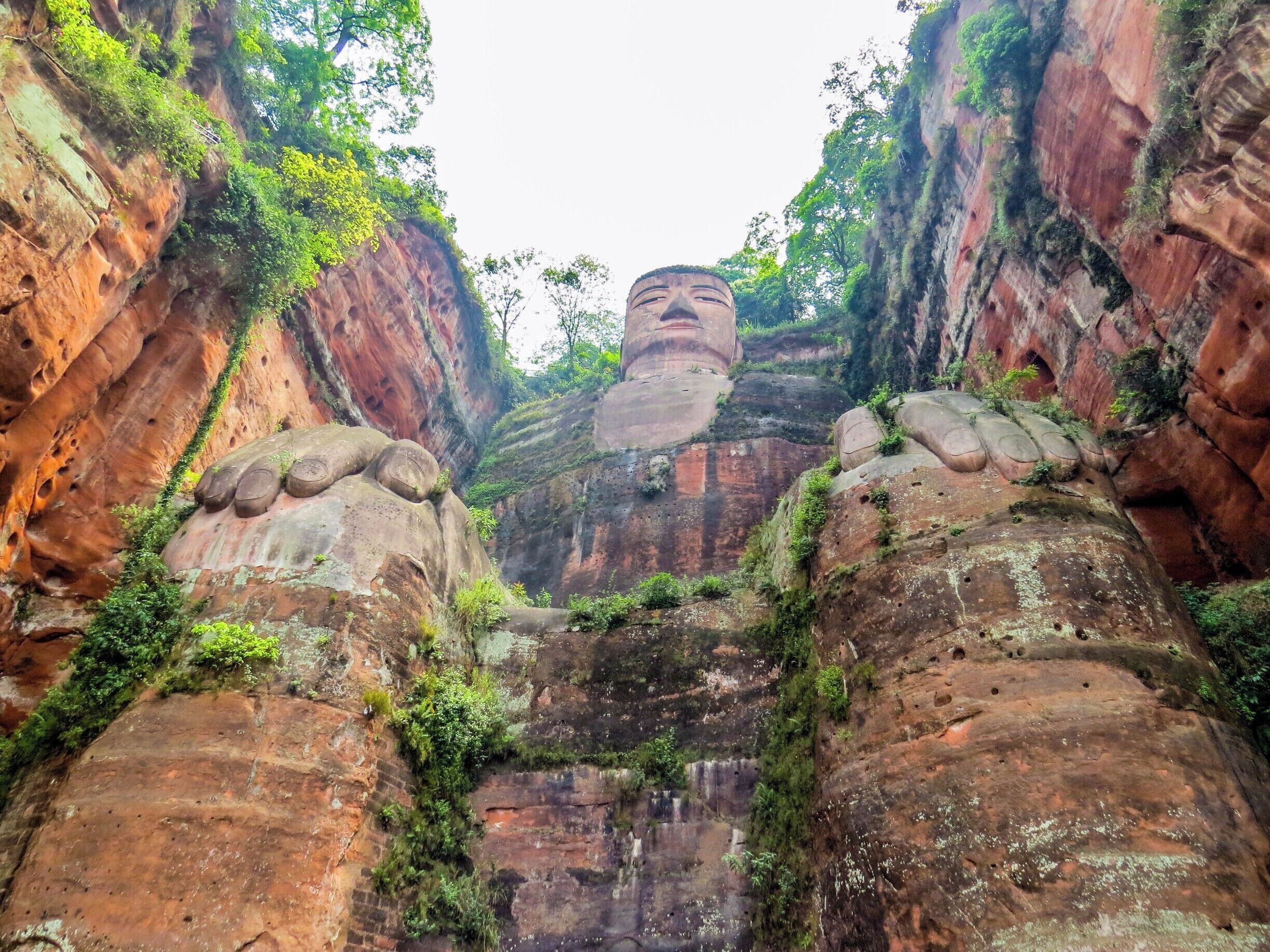 Giant Buddha in Leshan, China. It is a 71-metre (233 ft) tall stone statue, built during the Tang Dynasty, depicting Maitreya. It is carved out of a cliff face that lies at the confluence of the Minjiang, Dadu and Qingyi rivers in the southern part of Sichuan province in China, near the city of Leshan. The stone sculpture faces Mount Emei, with the rivers flowing below his feet. It is the largest stone Buddha in the world and it is by far the tallest pre-modern statue in the world.