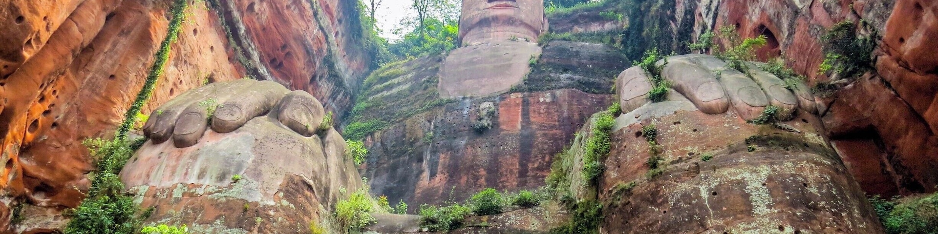 Giant Buddha in Leshan, China. It is a 71-metre (233 ft) tall stone statue, built during the Tang Dynasty, depicting Maitreya. It is carved out of a cliff face that lies at the confluence of the Minjiang, Dadu and Qingyi rivers in the southern part of Sichuan province in China, near the city of Leshan. The stone sculpture faces Mount Emei, with the rivers flowing below his feet. It is the largest stone Buddha in the world and it is by far the tallest pre-modern statue in the world.