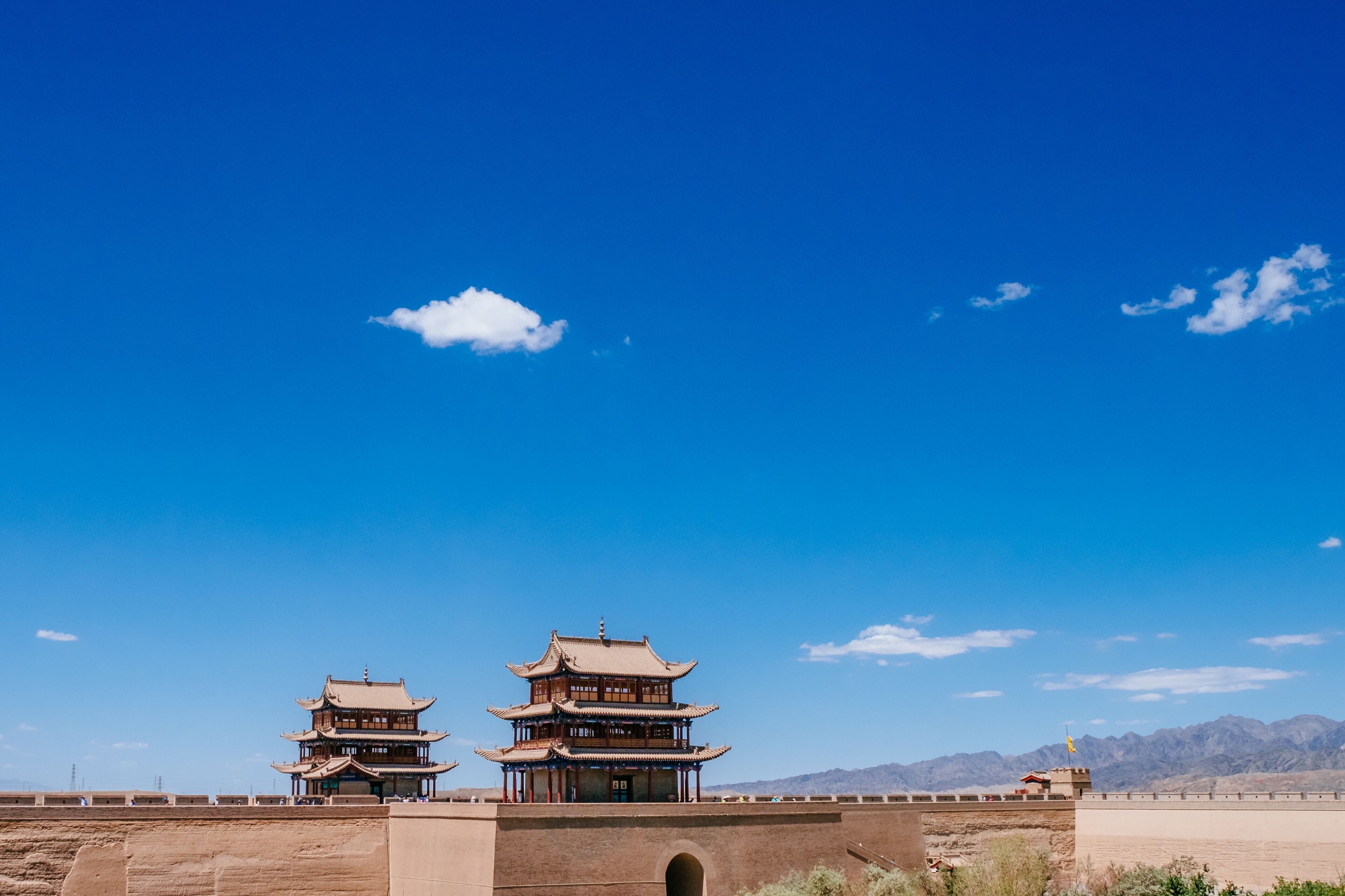 Gate tower building and walls under blue sky at Jiayu Pass, in Jiayuguan, China
