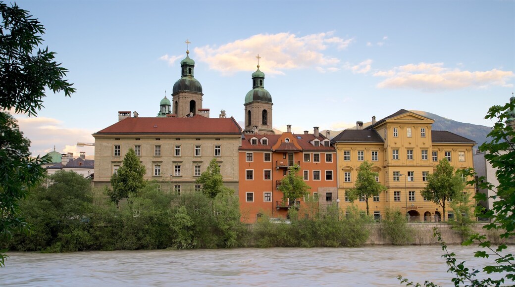Cathedral of St. James featuring heritage elements, a sunset and a lake or waterhole