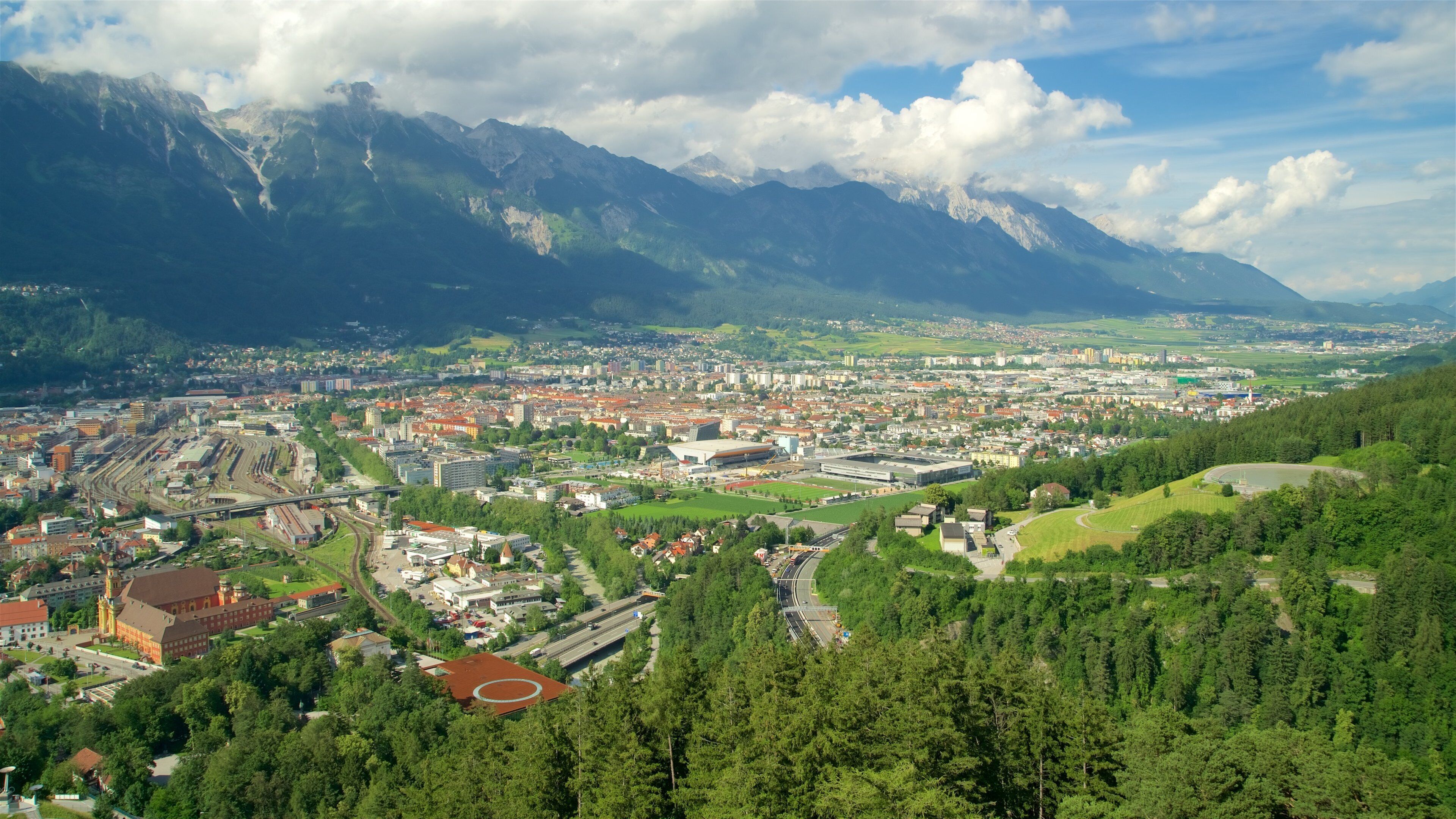 Bergisel Ski Jump featuring a city, mountains and tranquil scenes