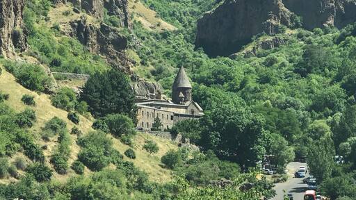 Geghard (Armenian: meaning "spear") is a medieval monastery in the Kotayk province of Armenia, being partially carved out of the adjacent mountain, surrounded by cliffs. It is listed as a UNESCO World Heritage Site.