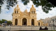 A large, historic church with two towers and a central dome.