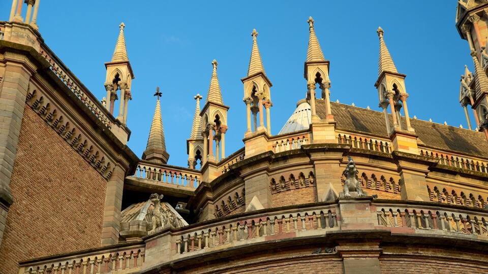 A historic building with multiple spires and intricate stonework.