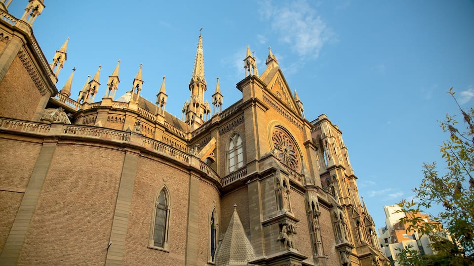 Sagrado Corazon Church which includes a sunset, religious elements and heritage architecture